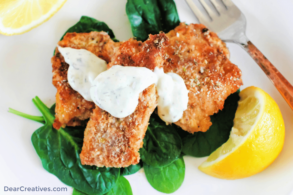 Breaded Fish Close up photo of breaded baked fish - Cod Fish sticks - Get the breaded fish recipe at DearCreatives.com (top down image of cod fish sticks) ©2023 DearCreatives.com
