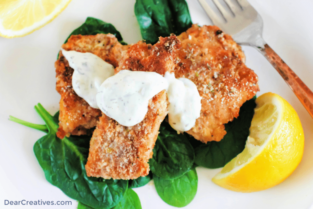Breaded Fish Close up photo of breaded baked fish - Cod Fish sticks - Get the breaded fish recipe at DearCreatives.com (top down image of cod fish sticks) ©2023 DearCreatives.com