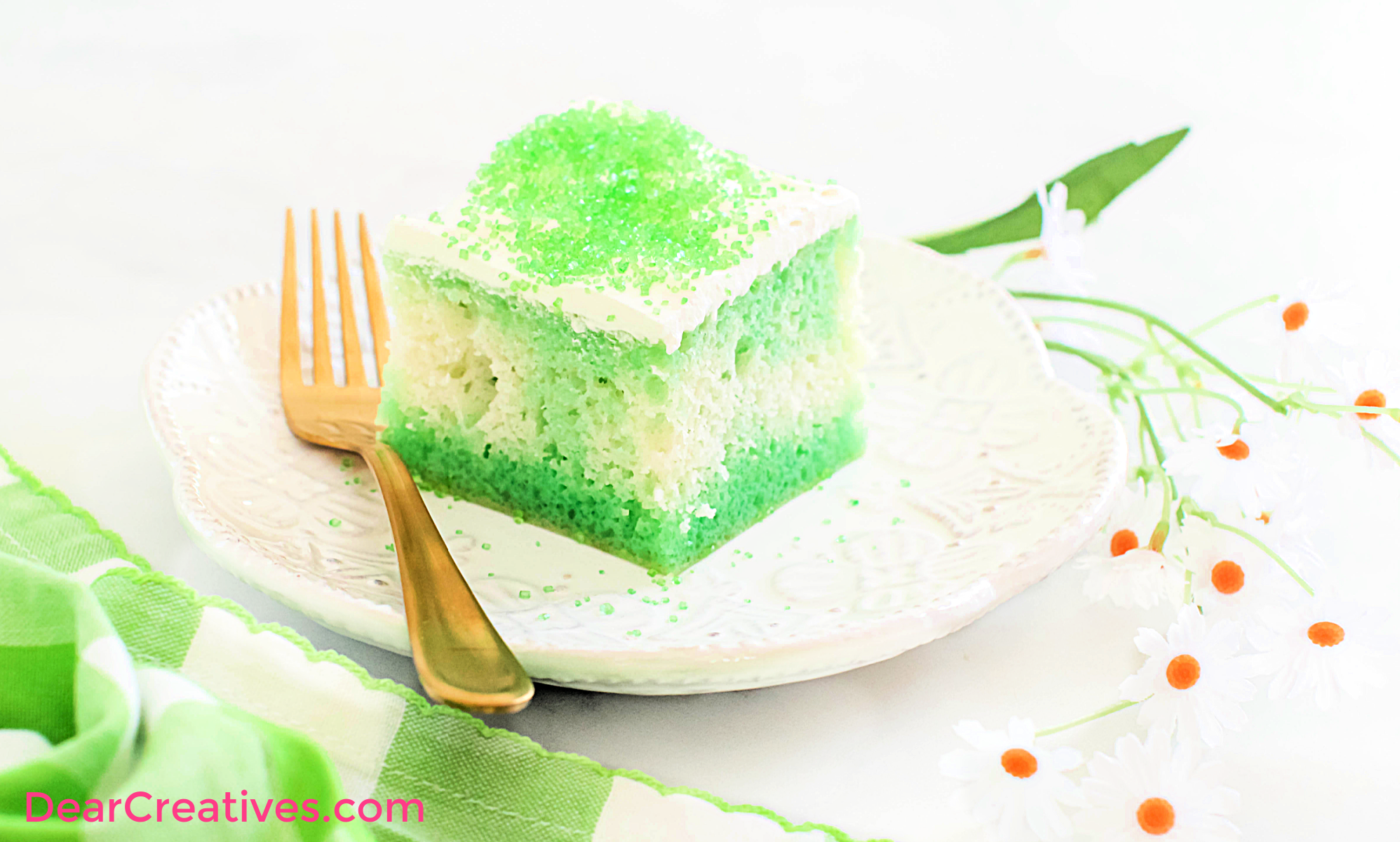 Lime Poke Cake - A moist white cake with lime Jell-O with a whipped topping and sprinkles - Get the easy cake recipe at ©2023 DearCreatives.com