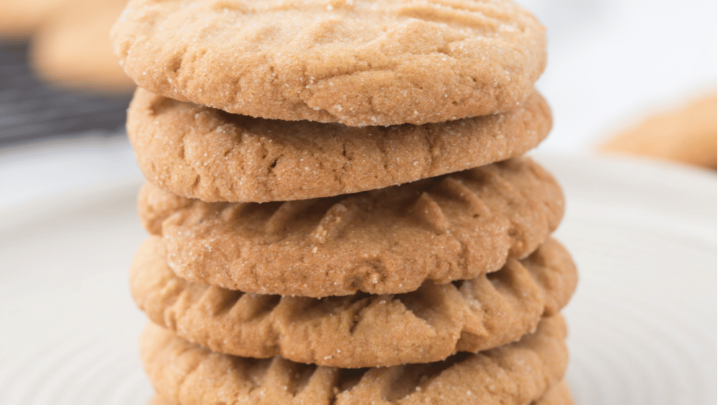 classic easy peanut butter cookies stacked on a plate