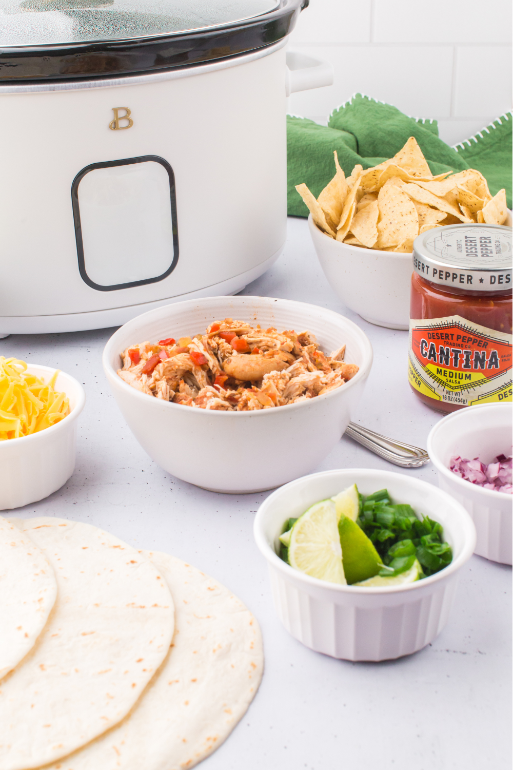 Chicken Tacos Slow Cooker - Easy, delicious, made in a few hours, perfect for dinner, Taco Tuesday, or a taco party. Get the chicken tacos recipe at DearCreatives.com