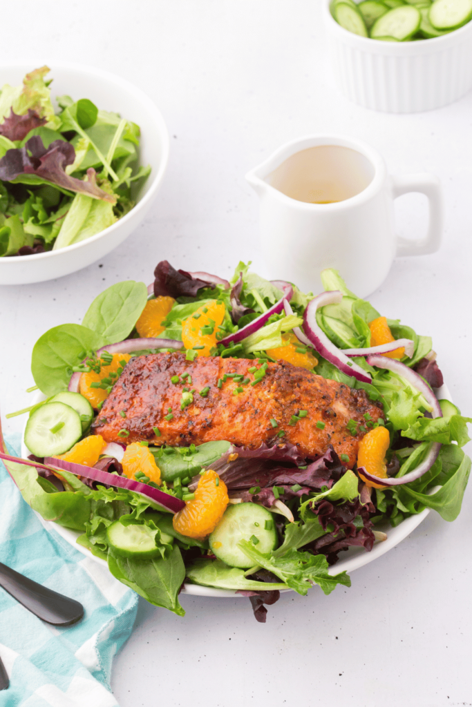 How to make salmon salad - Tasty, healthy, quick and easy to make! Fresh green salad topped with salmon... Click over for the recipe