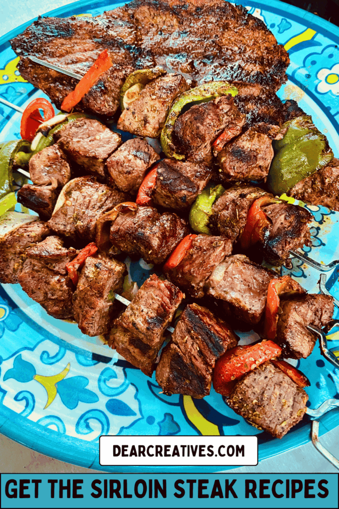 grilled top sirloin steak and shish kabobs on a platter the shish kabobs have vibrant green and red peppers and onions on them. Recipe at DearCreatives.com