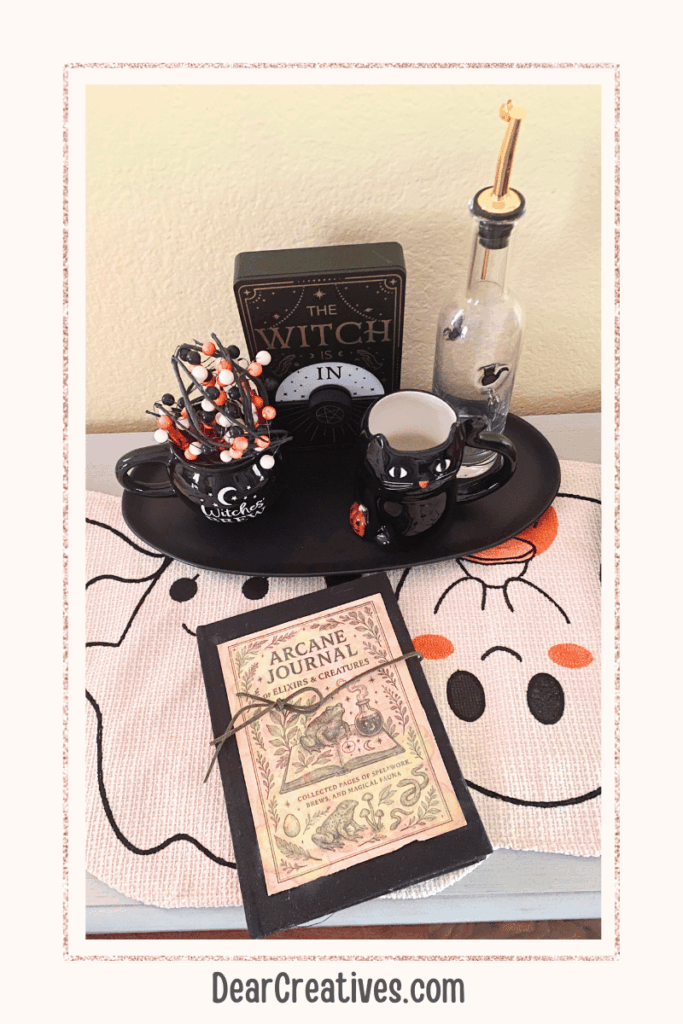 how I styled my DIY spell book, Grimoire Journal for Halloween. Get the instructions to make your own spellbook journal at DearCreatives.com
