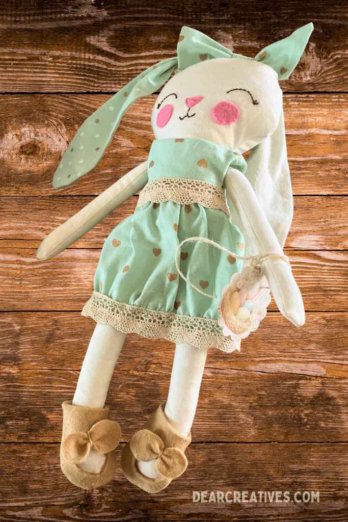 finished fabric bunny doll from sewing pattern wearing handmade outfit