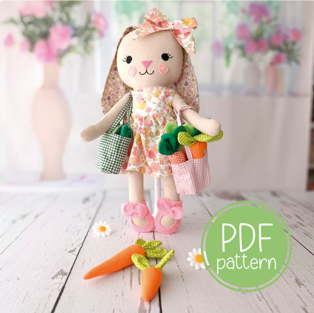 close up of the PDF sewing pattern for a soft bunny doll and mini doll tote bag and carrots pattern. 