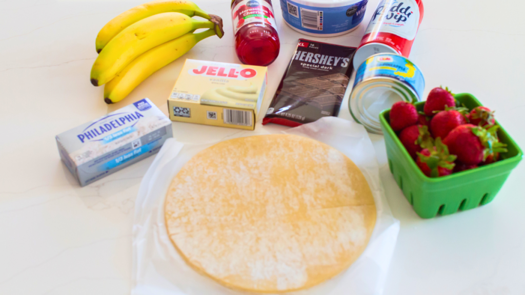 Photo of the ingredients in a banana split pie with a pastry crust